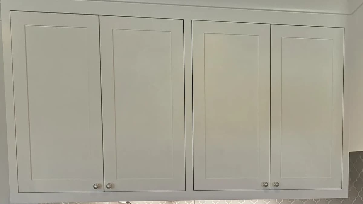 Close-up of a painted kitchen cabinet door with crisp, even edges