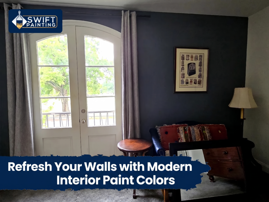 Navy blue accent wall in living room with white French doors and gray curtains